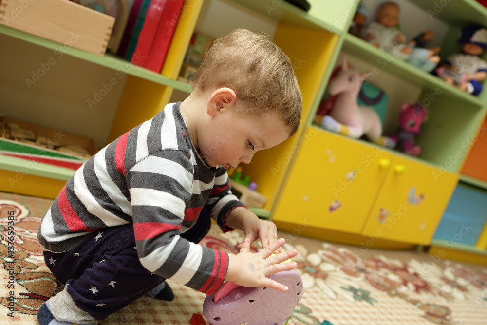 Сhild playing with toy