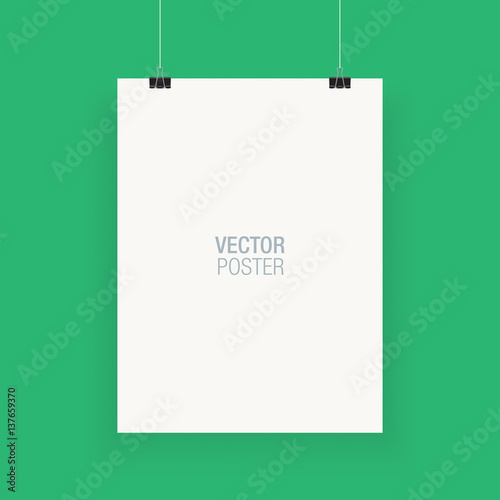 White vertical poster template hanging on clips, isolated on a green background. Poster realistic mokcup.