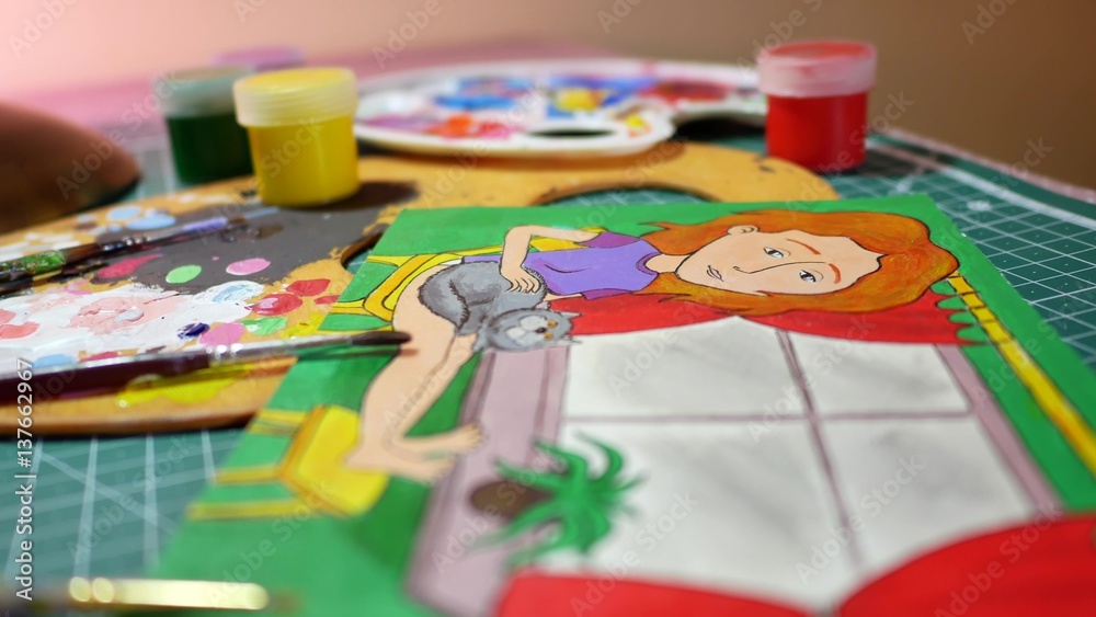 Man in the process of drawing with acrylic paints picture of girl Man in the process of drawing with acrylic paints picture of girl