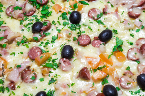 Appetizing delicious pizza with olives black olives close-up
