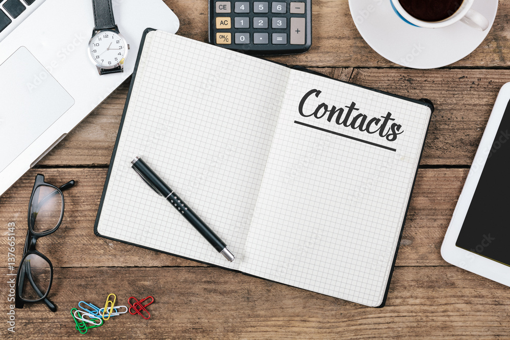 Contacts on note book at office desktop
