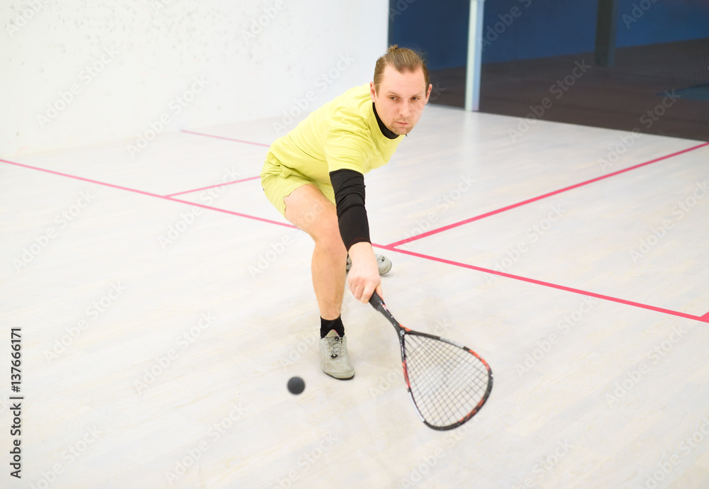 man playing squash