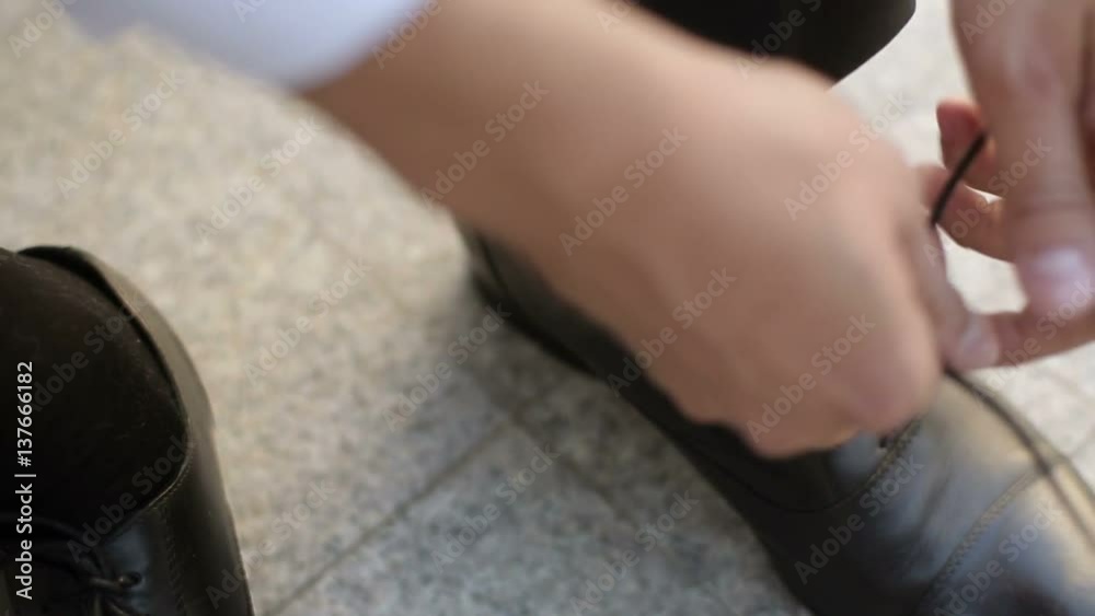 Man wearing black shoes at sunny day Man wearing black shoes at sunny day