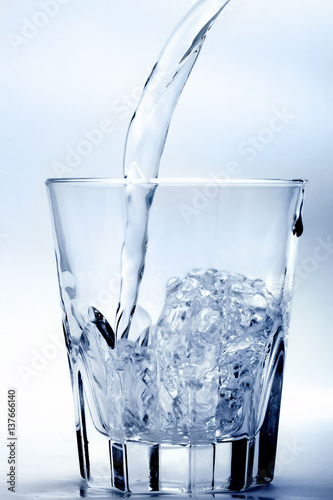 Glass of water in blue silver tonality 