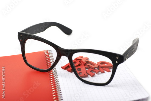 Reading glasses over a notebook