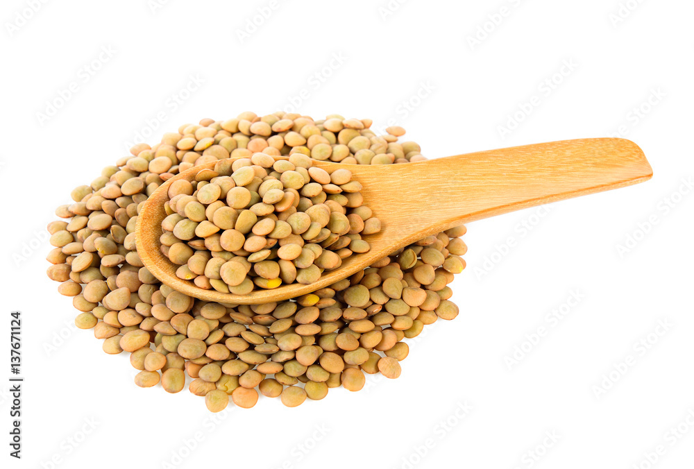 lentils in wood spoon isolated on white background lentils in wood spoon isolated on white background