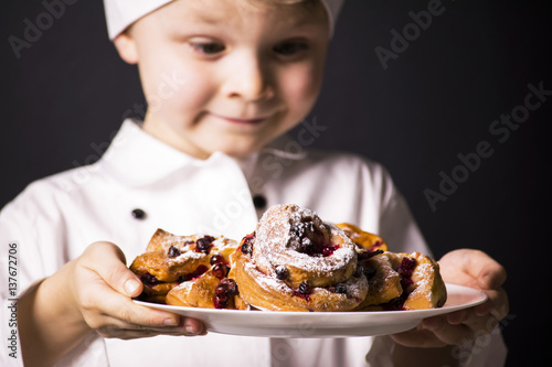 Chef holding croissants with cranberry
