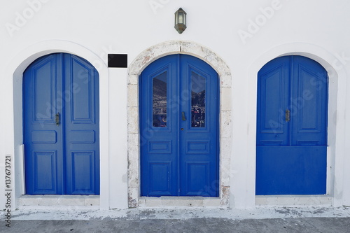 Blue doors of waterfront restored house-central main harbor. Kastellorizo-Greece. 1699