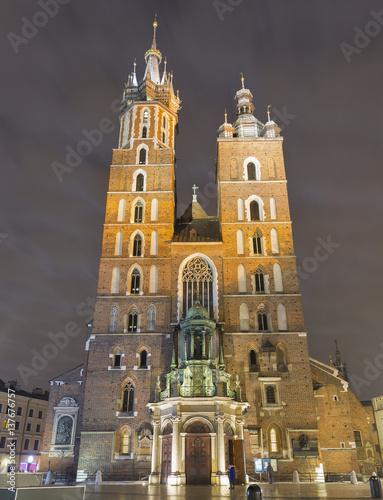St. Mary gothic church facade at night in Krakow, Poland