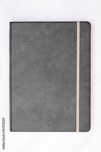 Grey cover of notebook with whit background.