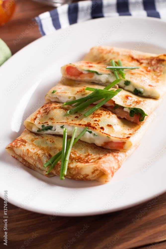 Healthy Breakfast crepes with bacon, cheese, greens, tomatoes on a wooden table. Selective focus Healthy Breakfast crepes with bacon, cheese, greens, tomatoes on a wooden table. Selective focus