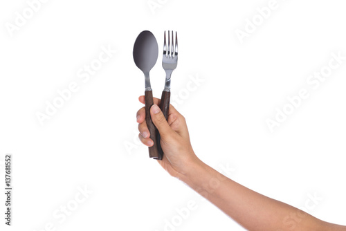 Fork and spoon held by a woman's hands isolated © nipastock