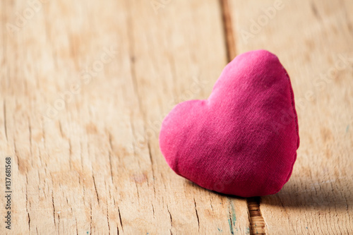 Heart from cloth on wood desk