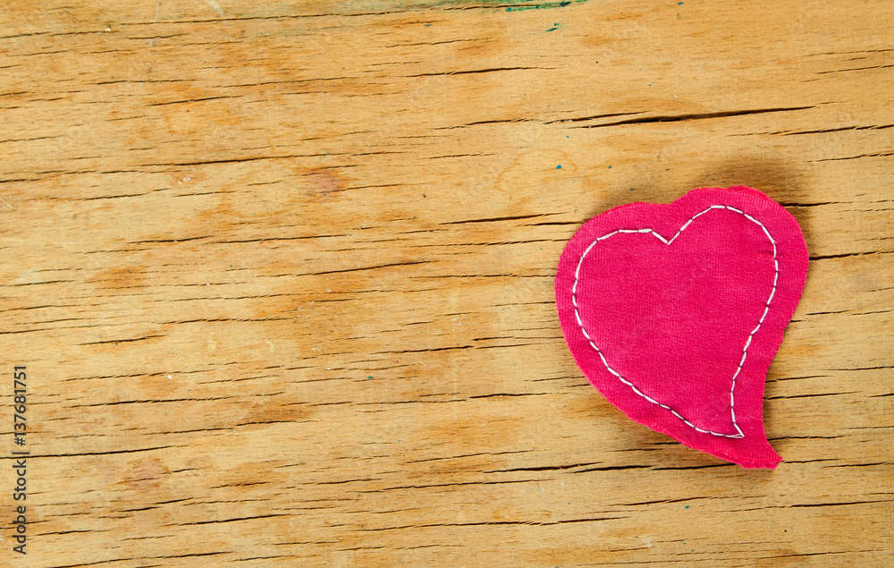 Heart from cloth on wood desk Heart from cloth on wood desk