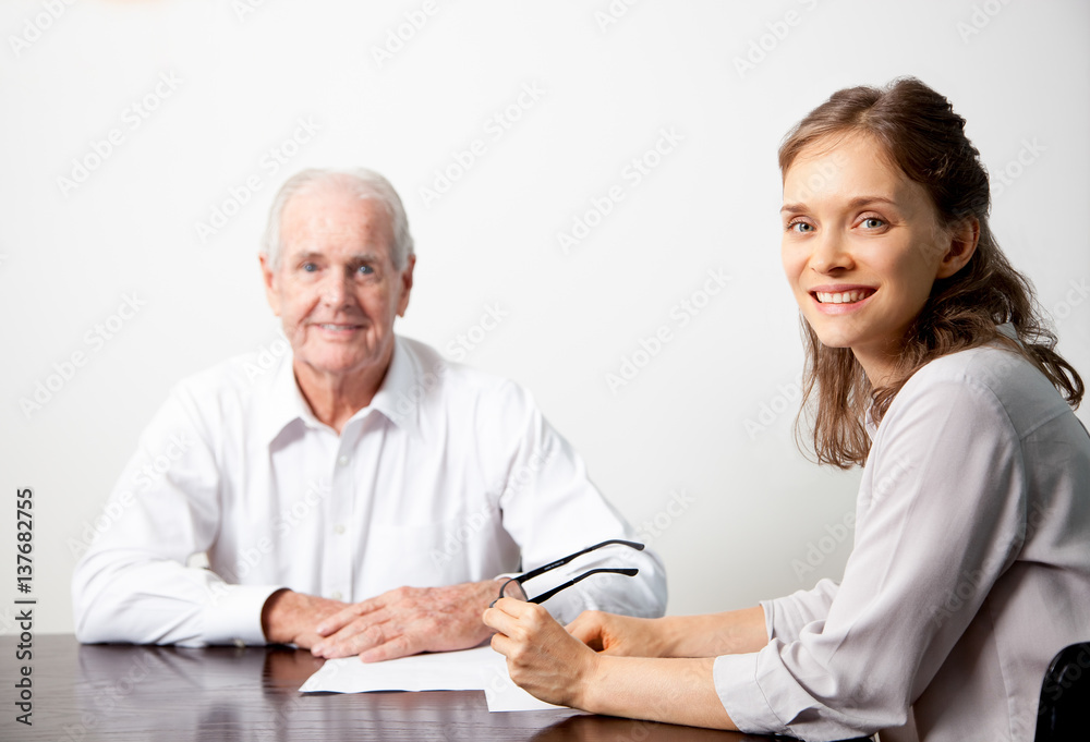 Smiling business people at conference table Smiling business people at conference table