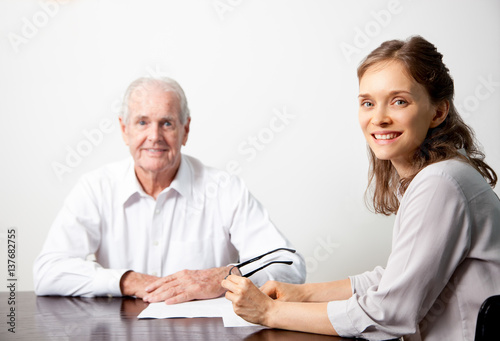 Smiling business people at conference table
