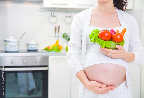 Pregnant woman with healthy food