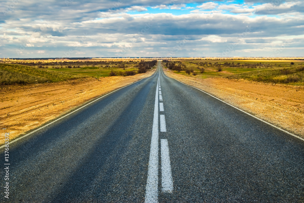 Empty straight road in the desert, the highway M6 