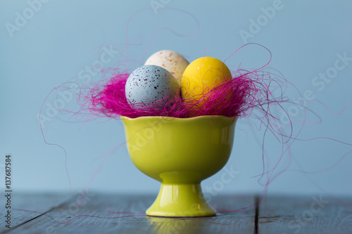 Easter eggs of bright colors, closeup and pink  decoratie photo