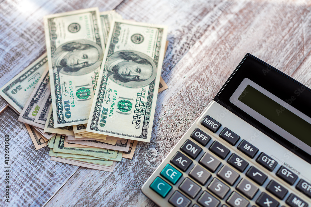 calculator isolated on a wooden background calculator isolated on a wooden background