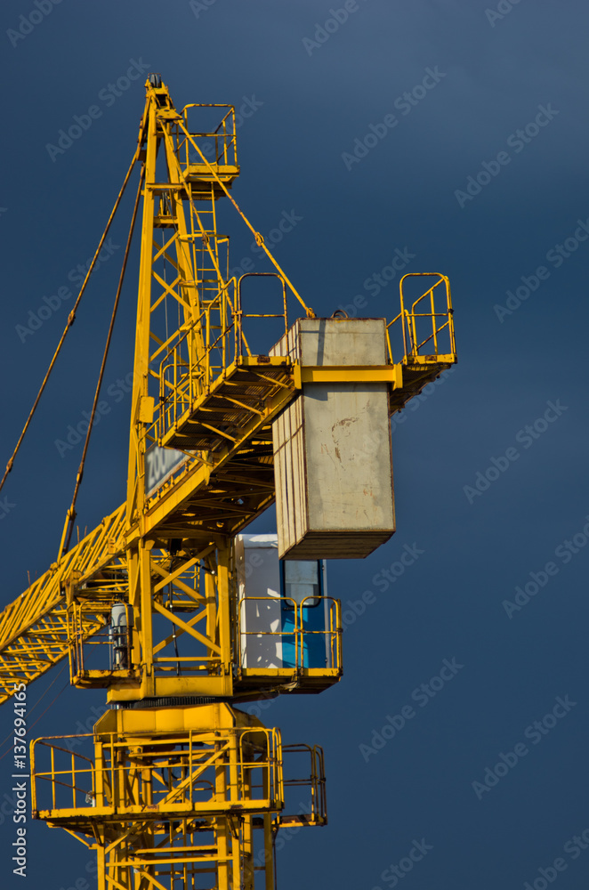 Yellow construction crane against dark blue sky in Belgrade, Serbia Yellow construction crane against dark blue sky in Belgrade, Serbia