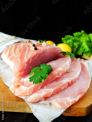 Fresh sliced pork carbonade on a wooden board 