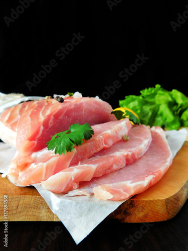 Fresh sliced pork carbonade on a wooden board 