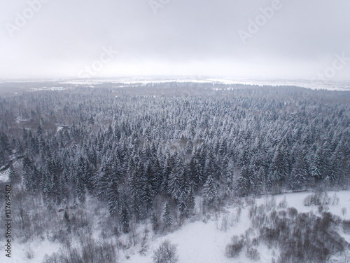 winter landscape photographed from above the forest and river © annaav