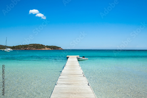 Pontoon in the turquoise water of Rondinara beach in Corsica Island in France