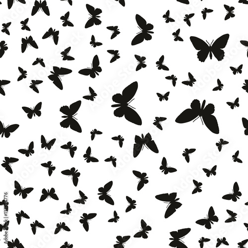 Symmetrical pattern of random butterflies black on white. Suitable for festive and celebratory decoration.