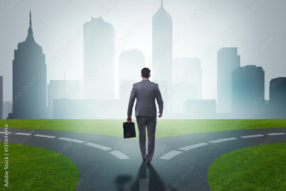 Businessman in difficult choice concept Businessman in difficult choice concept