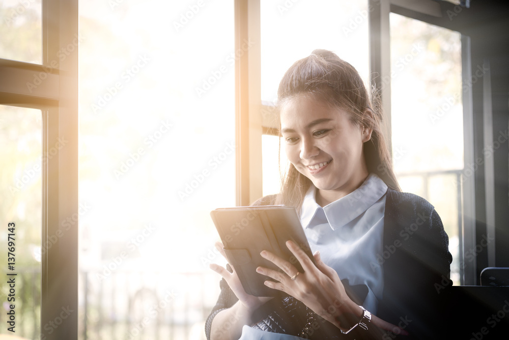 Young woman using tablet in coffee shop Young woman using tablet in coffee shop