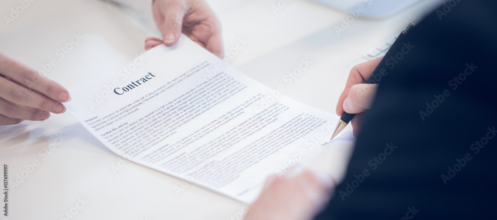 Businessman signing a contract Businessman signing a contract