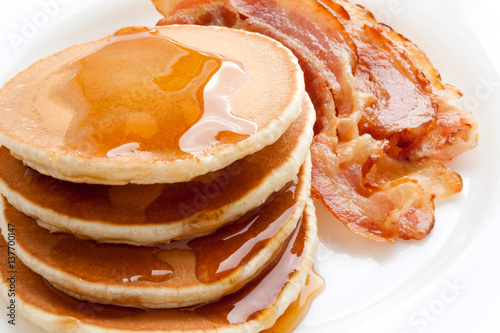 Pancakes with maple syrup and Bacon on a white background. Breakfast, snacks. Shrove Tuesday.