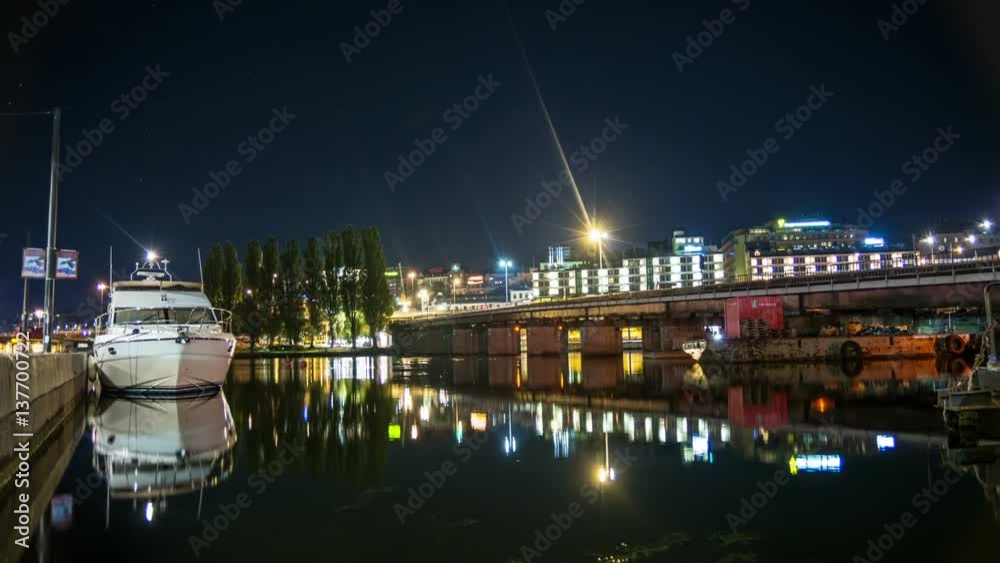 Time Lapse Tilt of railway bridge and water in Stockholm city. Subway trains passing by, reflections in the water Time Lapse Tilt of railway bridge and water in Stockholm city. Subway trains passing by, reflections in the water