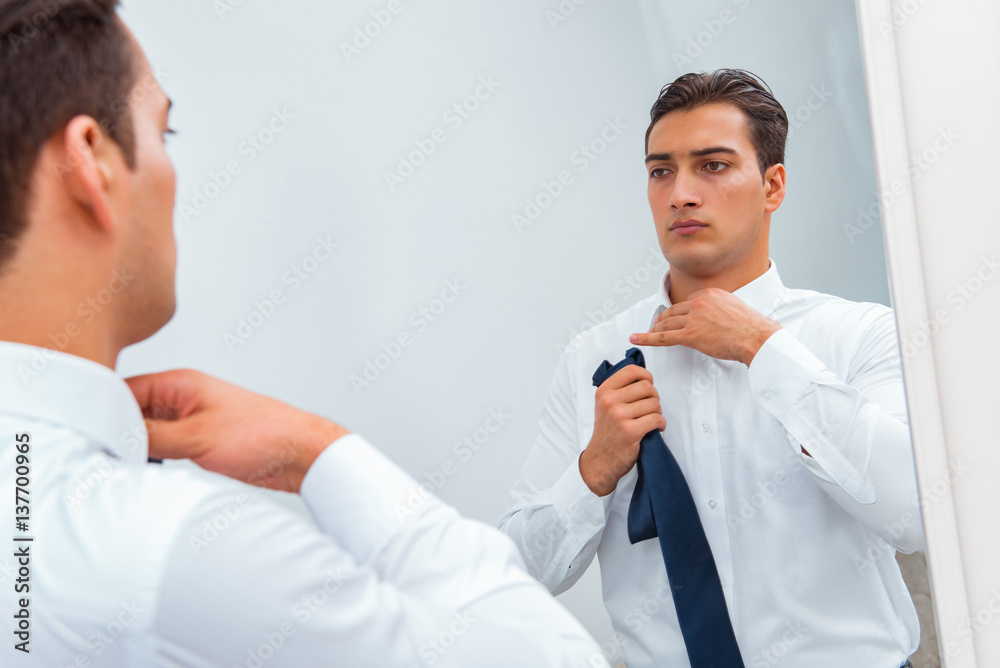 Businessman dressing up for work Businessman dressing up for work