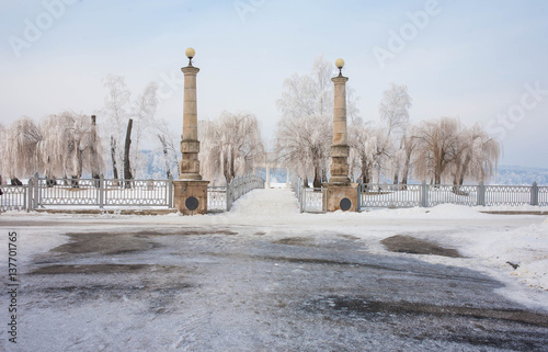 Ancient columns in the winter in the snow. photo