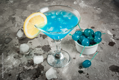 Party, cocktails blue lagoon or blue curacao on concrete stone table