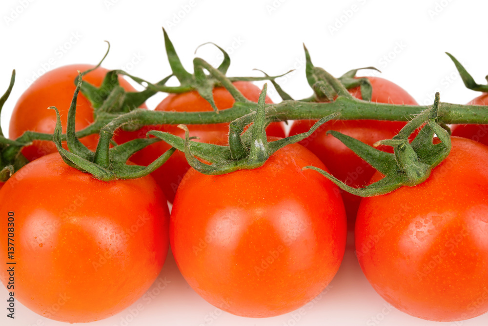 cherry tomatoes with dew closeup on a white background cherry tomatoes with dew closeup on a white background