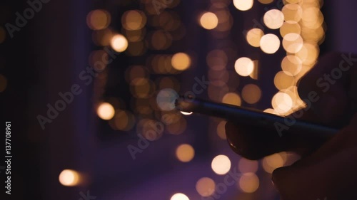 Closeup of young man hands typing sms scrolling pictures phone