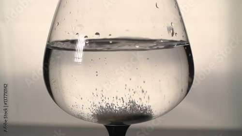 the effervescent tablets and glass with water