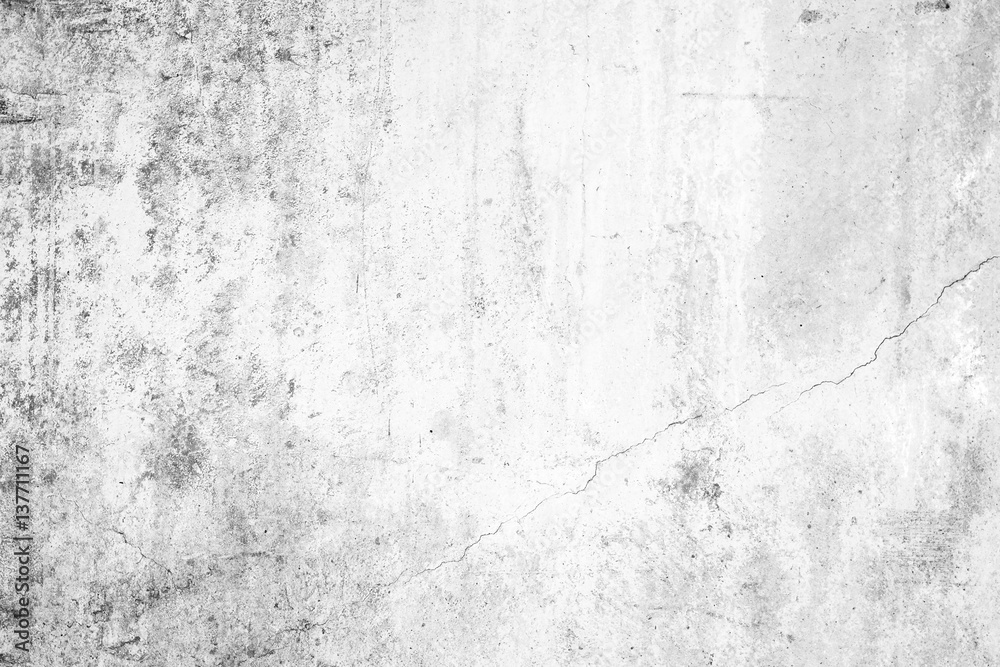Worn concrete wall texture background with paint partly faded, in black&white.
