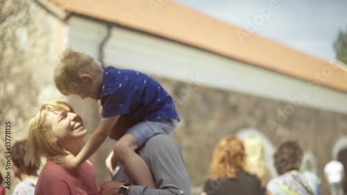 Young parents walking with their son in architectural courtyard