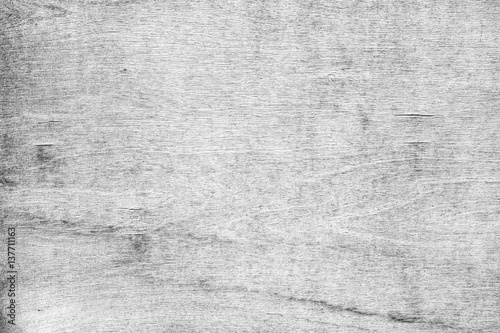 Close-up of a cracked and weathered plywood texture background in black&white. photo