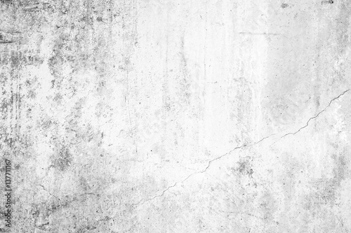 Worn concrete wall texture background with paint partly faded, in black&white. © tuomaslehtinen