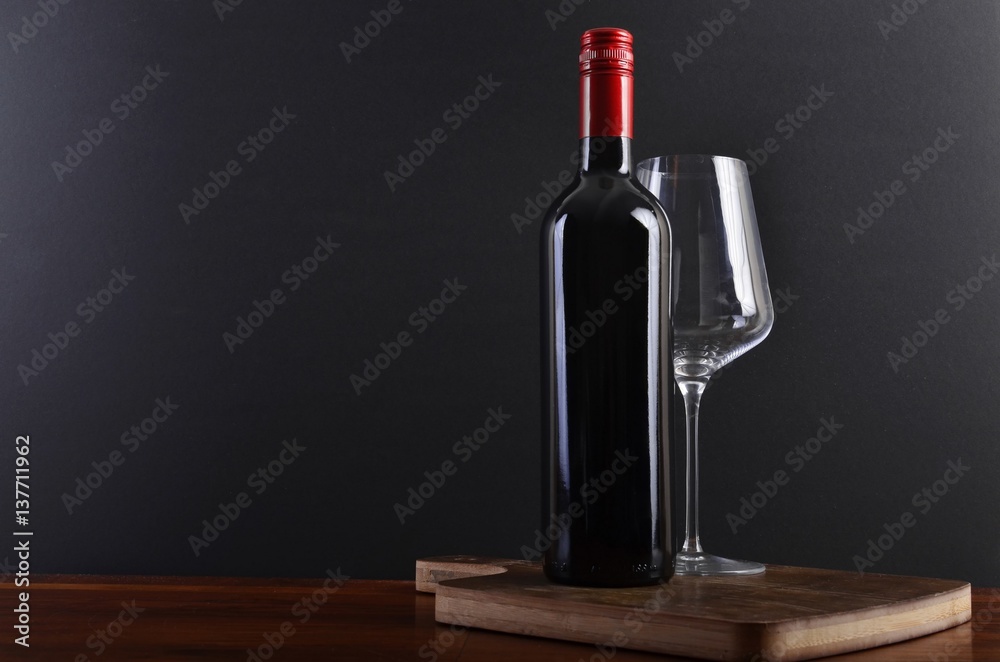Red wine on board with glass