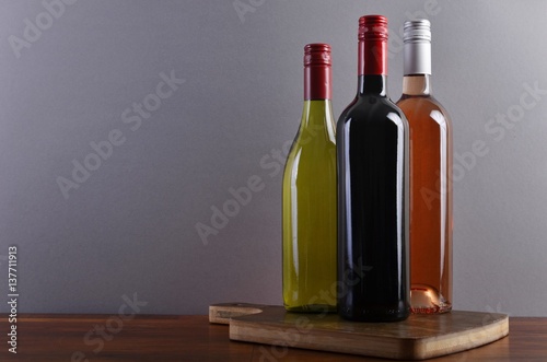 Three bottles on a board © szulyphoto