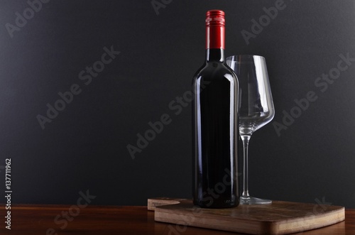Red wine on board with glass © szulyphoto