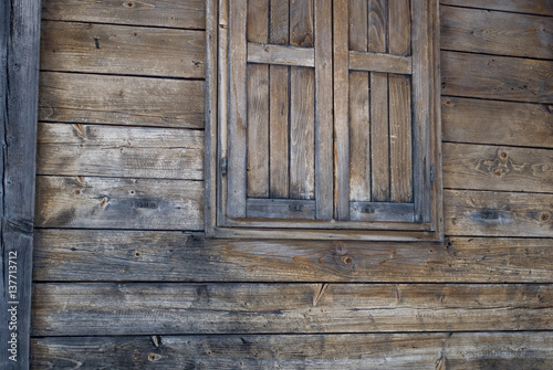 Background of Vintage mountain chalet, an old window of an old wooden little house, Dolomiti, Trentino Alto Adige, Italia