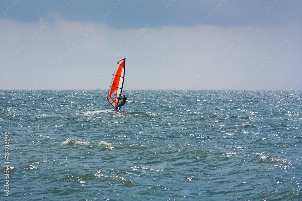 skiing windsurfing in the ocean waves skiing windsurfing in the ocean waves